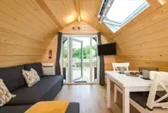 Deluxe glamping pod double sofa bed (bring bedding) and seating area