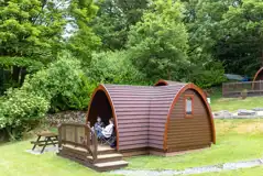 Family Vista camping pod with a deck area and picnic bench