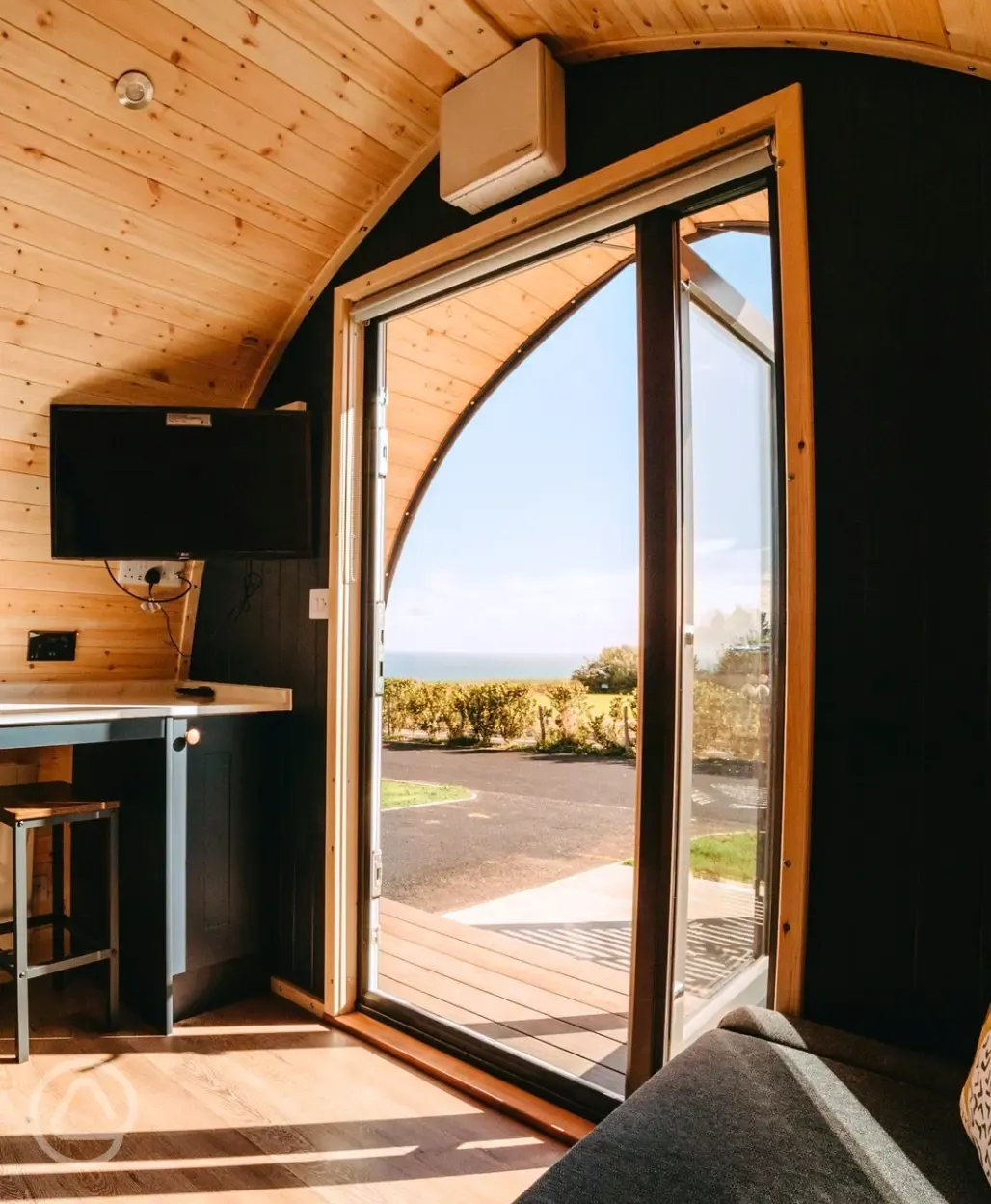 Mega ensuite glamping pod - living area and sea views