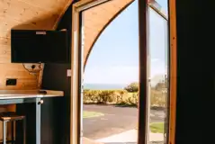 Mega ensuite glamping pod - living area and sea views