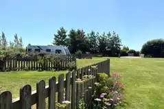 Fully serviced grass pitches with 16 amp electric, water and grey waste