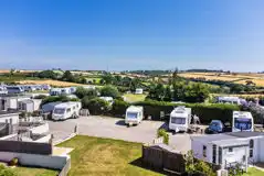 Overview of touring pitches and glamping cabins at Parkland Caravan Site