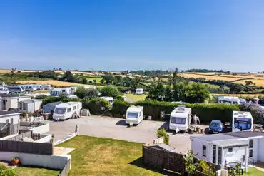 Overview of touring pitches and glamping cabins at Parkland Caravan Site