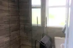 Toilet in the private washroom for the deluxe grass and gravel pitches