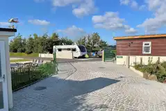 Deluxe grass and gravel pitches with a private washroom