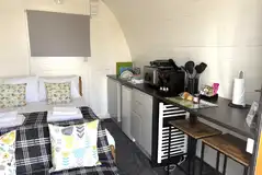 Glamping pod with a double bed and kitchenette