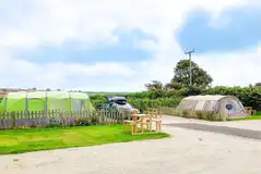 Deluxe grass and gravel pitches with a private washroom