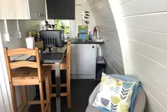 Ensuite glamping pod kitchen with a small seating area