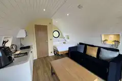 Saltwick Escape glamping pod interior with sofa bed (four persons) Saltwick Escape glamping pod interior with sofa bed (four persons)