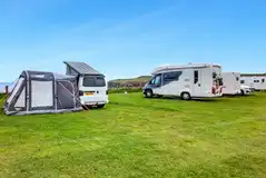 Electric grass pitches with sea views (awning)