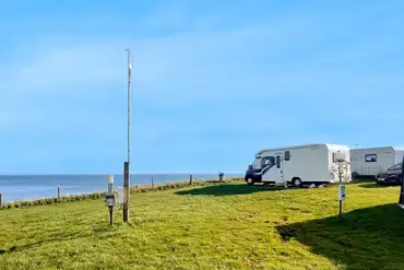 Electric grass pitches with sea views (no awning)