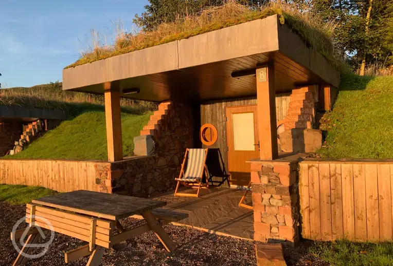 Glamping burrows with grassed roofs