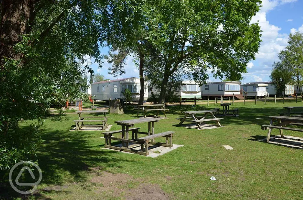 Picnic benches by the static caravans
