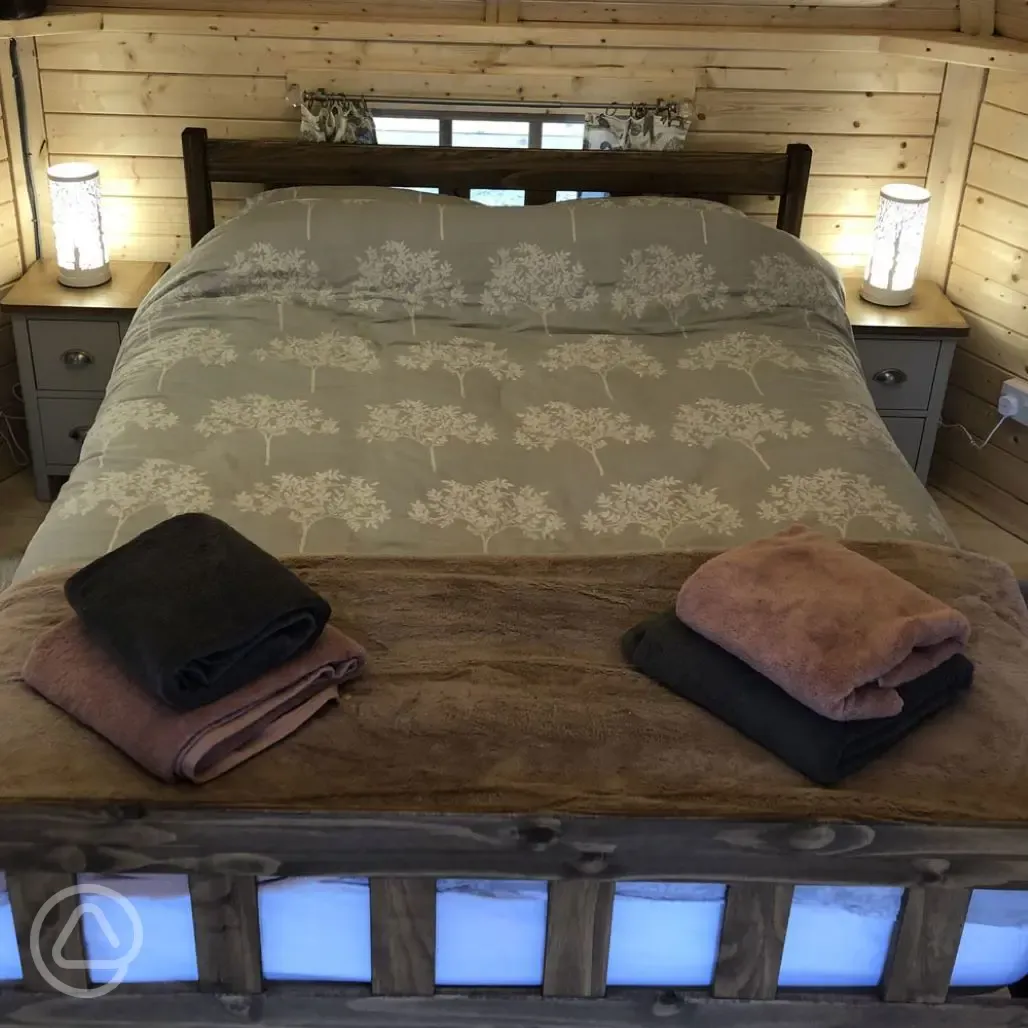 Enchanted cottage bedroom with bedding and towels provided