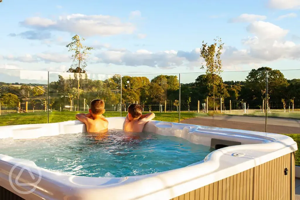 Studio Lodges Plus hot tub on decking area Studio Lodges Plus hot tub on decking area