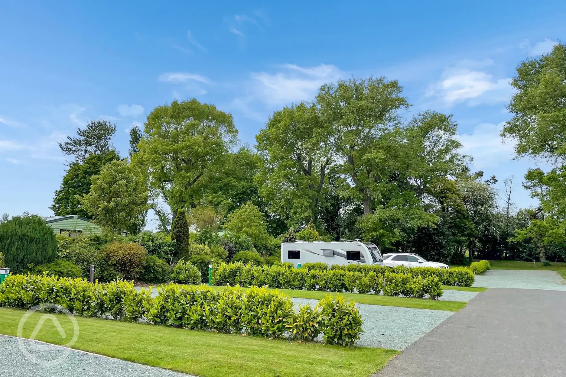 Hardstanding pitches with hedges for privacy Hardstanding pitches with hedges for privacy