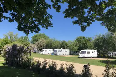 Hardstanding pitches at Old Brick Kilns surrounded by trees