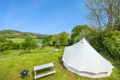 Bell tent at the top of the cider apple orchard with valley views