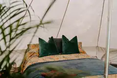 Bell tent with a double bed and two single camp beds (bedding included)