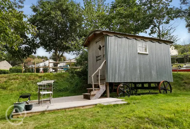 Shepherd's hut with a small outdoor deck