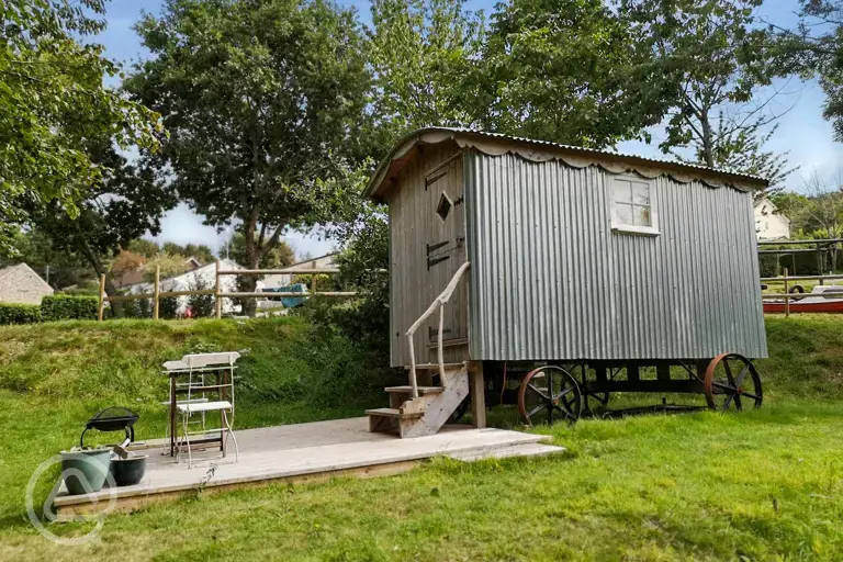 Shepherd's hut with a small outdoor deck