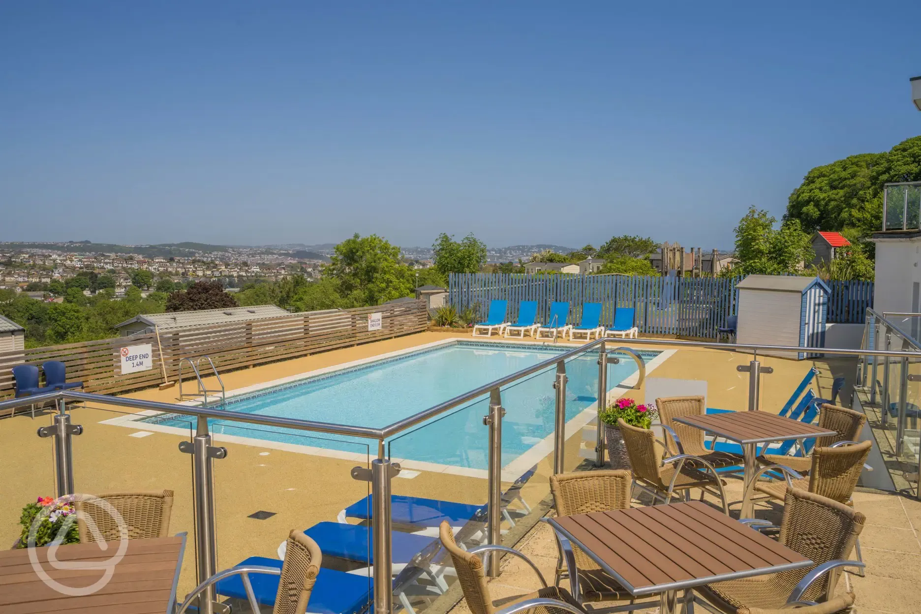 Cove outdoor pool with sun loungers (open during the summer)