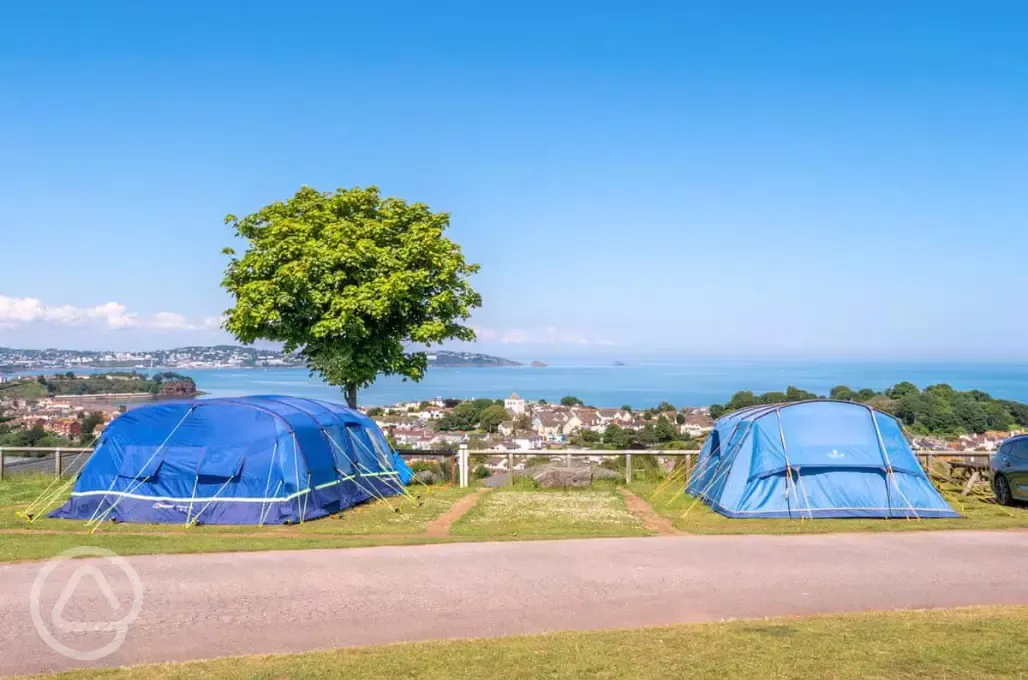 Tents on electric grass pitches with sea views
