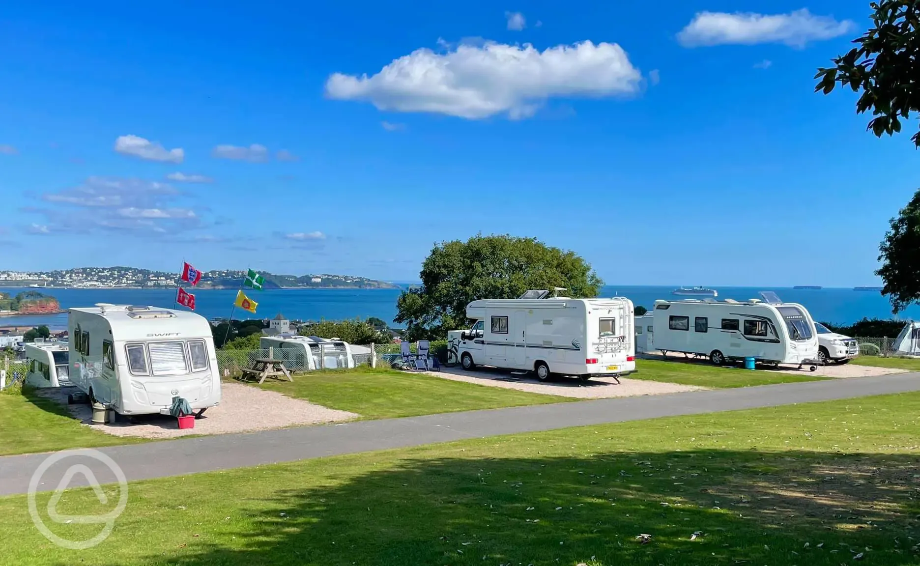 Caravan, campervan, and motorhomes on hardstanding pitches with sea views