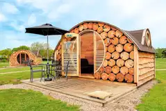 Log pods with round entrance ways and porthole windows