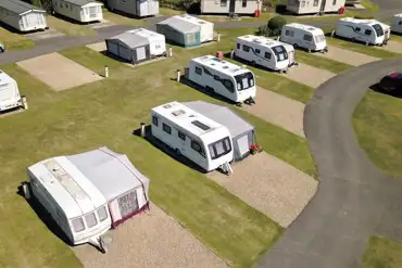 Aerial of the fully serviced all weather touring pitches