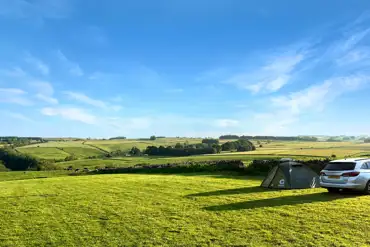 Non electric grass touring pitches overlooking the Peak District at Haddon Grove