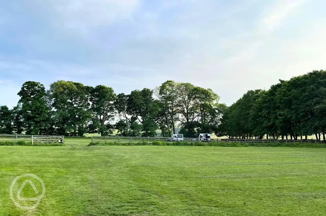 Non electric grass touring pitches with an entrance gate