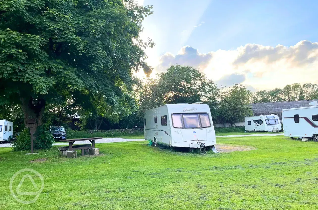 Electric hardstanding touring pitches with a picnic bench