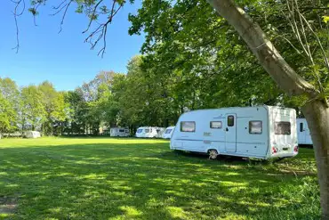 Caravan on a non electric grass touring pitch at Haddon Grove Campsite