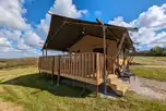 Luxury safari tent exterior with outdoor decking