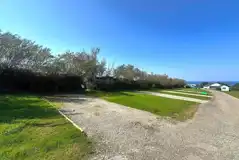 Electric hardstanding pitches with 16 amp electric hook up, measuring 8m by 6m