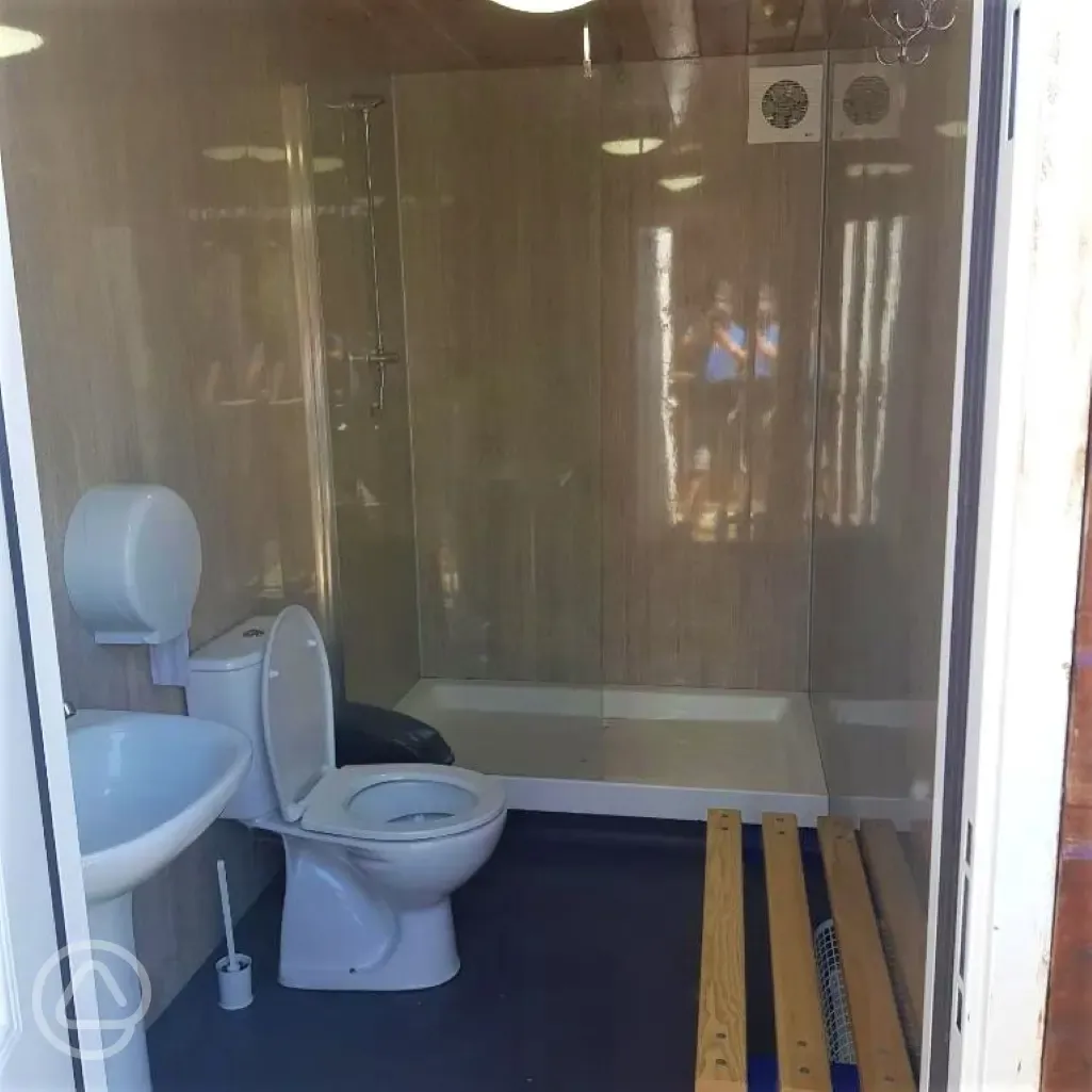Bathroom with hot showers and benches