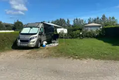 Large fully serviced hardstanding pitches with awning space and individual lawns