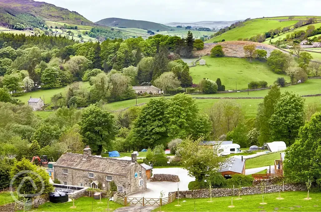 Site overview with facilities and hills behind