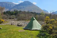 Non electric wild pitches on the banks of the River Coe at Red Squirrel Campsite