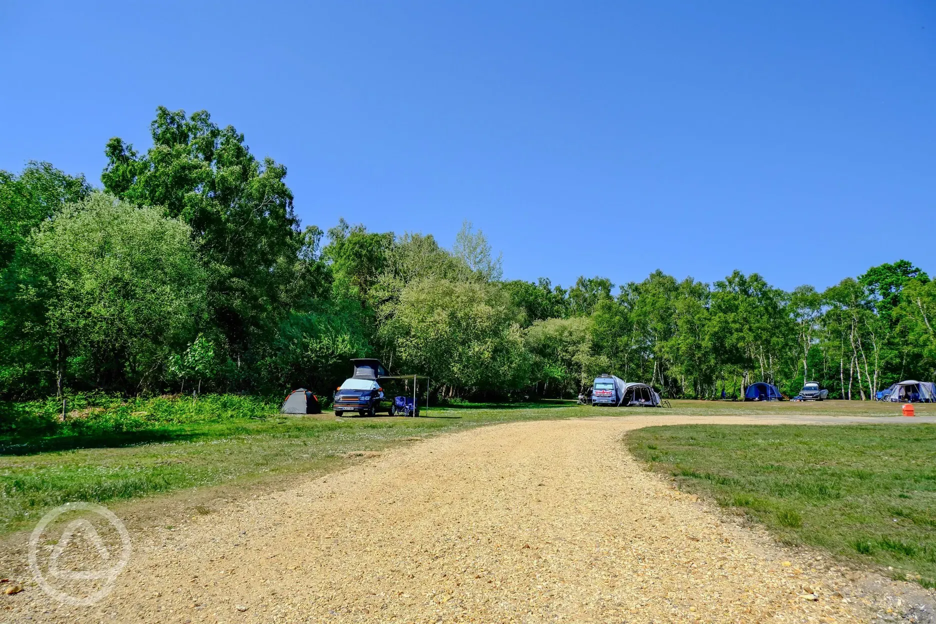 Non electric grass pitches with parking permitted for one car only