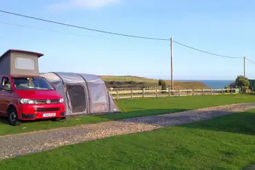 Grass pitches with space for an awning at Grange Farm 