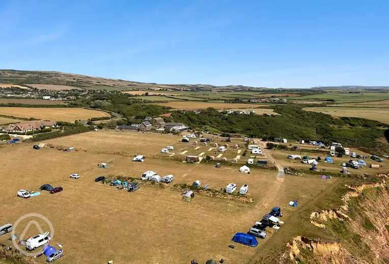Aerial of the grass, hardstanding, and glamping pitches at Grange Farm 