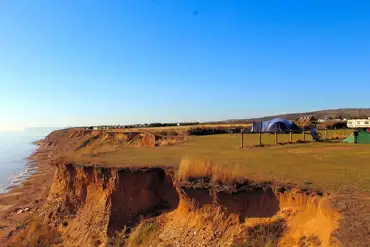 Grass pitches at Grange Farm with sea views on the Isle of Wight