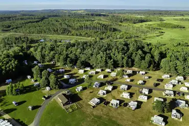 Aerial of Birchwood Tourist Park surrounded by forest