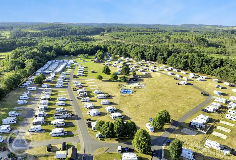 Aerial of Birchwood Tourist Park surrounded by forest