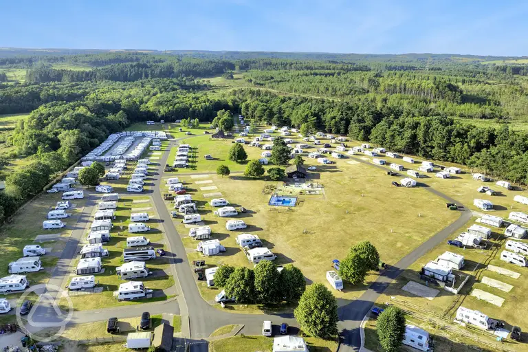 Aerial of Birchwood Tourist Park surrounded by forest