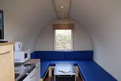 Camping pod interior with mattresses, folding table, lighting and heating Camping pod interior with mattresses, folding table, lighting and heating