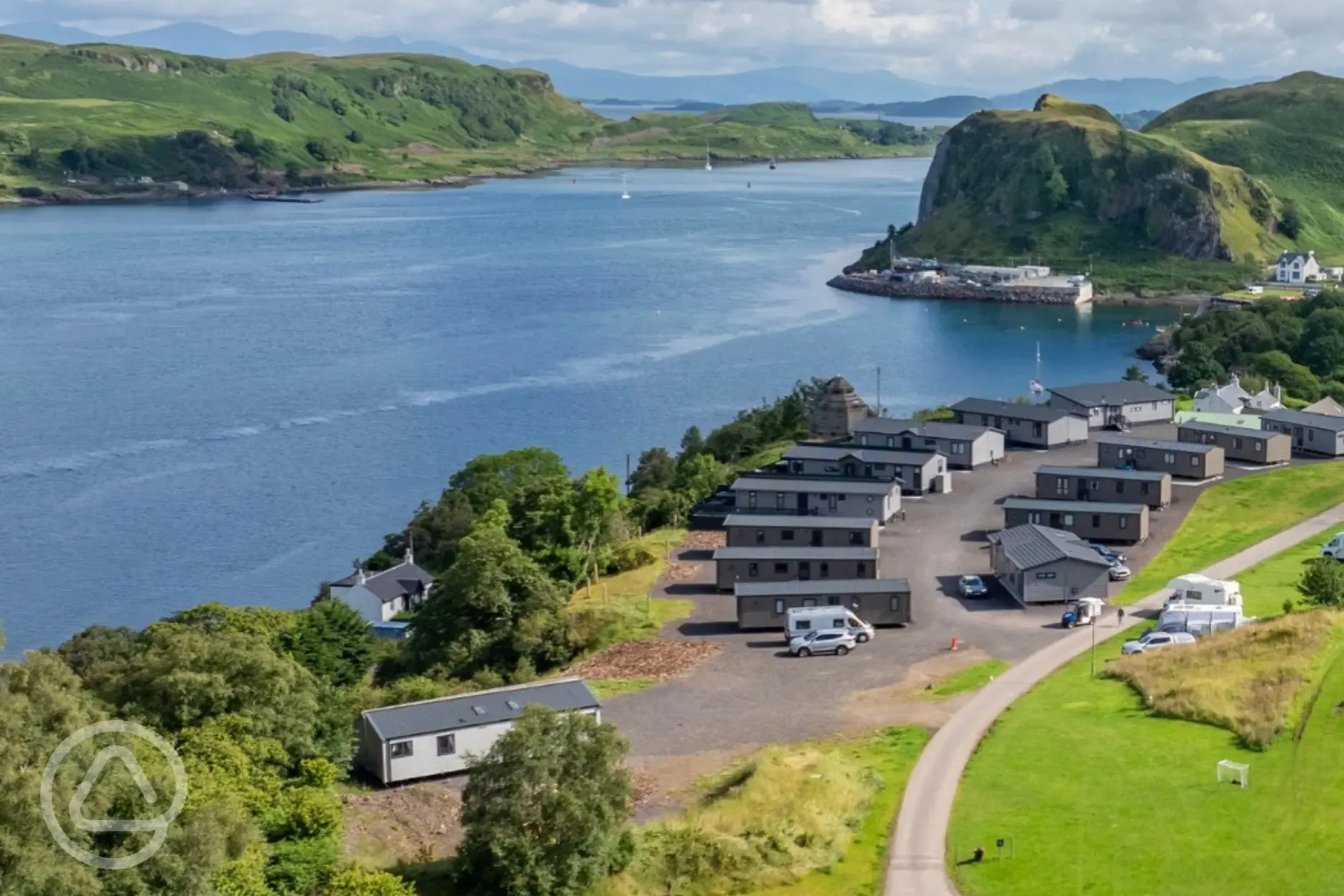 Grass pitches near static caravans with sea views