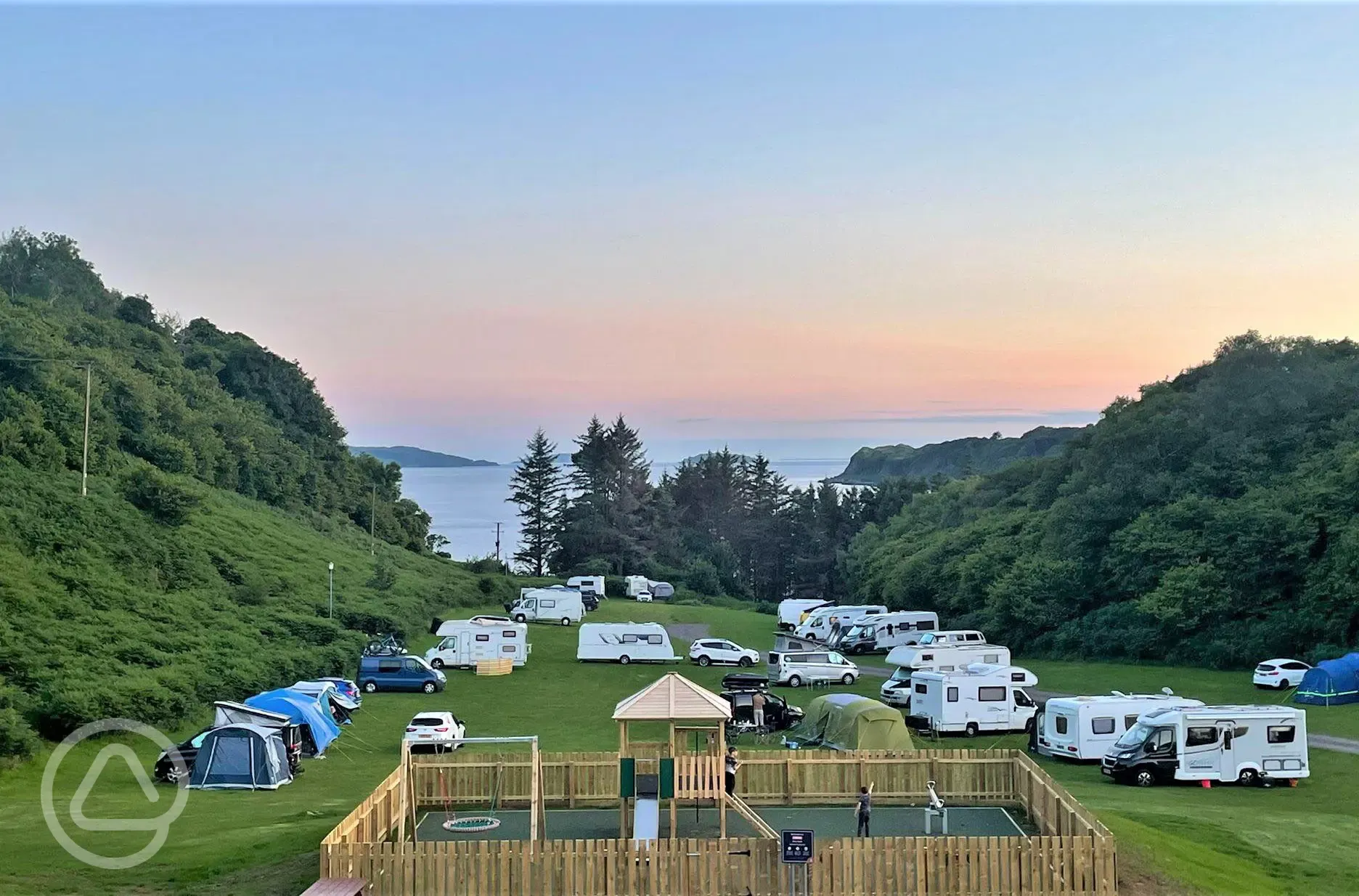 Campsite and playpark at sunset